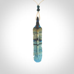 Hand carved Woolly Mammoth Tusk Blue Jay feather pendant. Hand made from Mammoth Tusk stabilised with resin. Art to Wear, one only. Provided with adjustable cord.