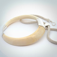 Boars Tusk Pendant with a sterling silver cap. Hand made pendant carved from a boars tusk. Hand made unique jewellery for sale by NZ Pacific online.