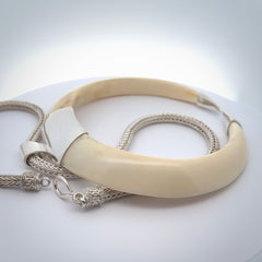 Boars Tusk Pendant with a sterling silver cap. Hand made pendant carved from a boars tusk. Hand made unique jewellery for sale by NZ Pacific online.
