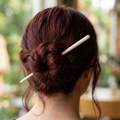 Woman wearing a bone hair pin