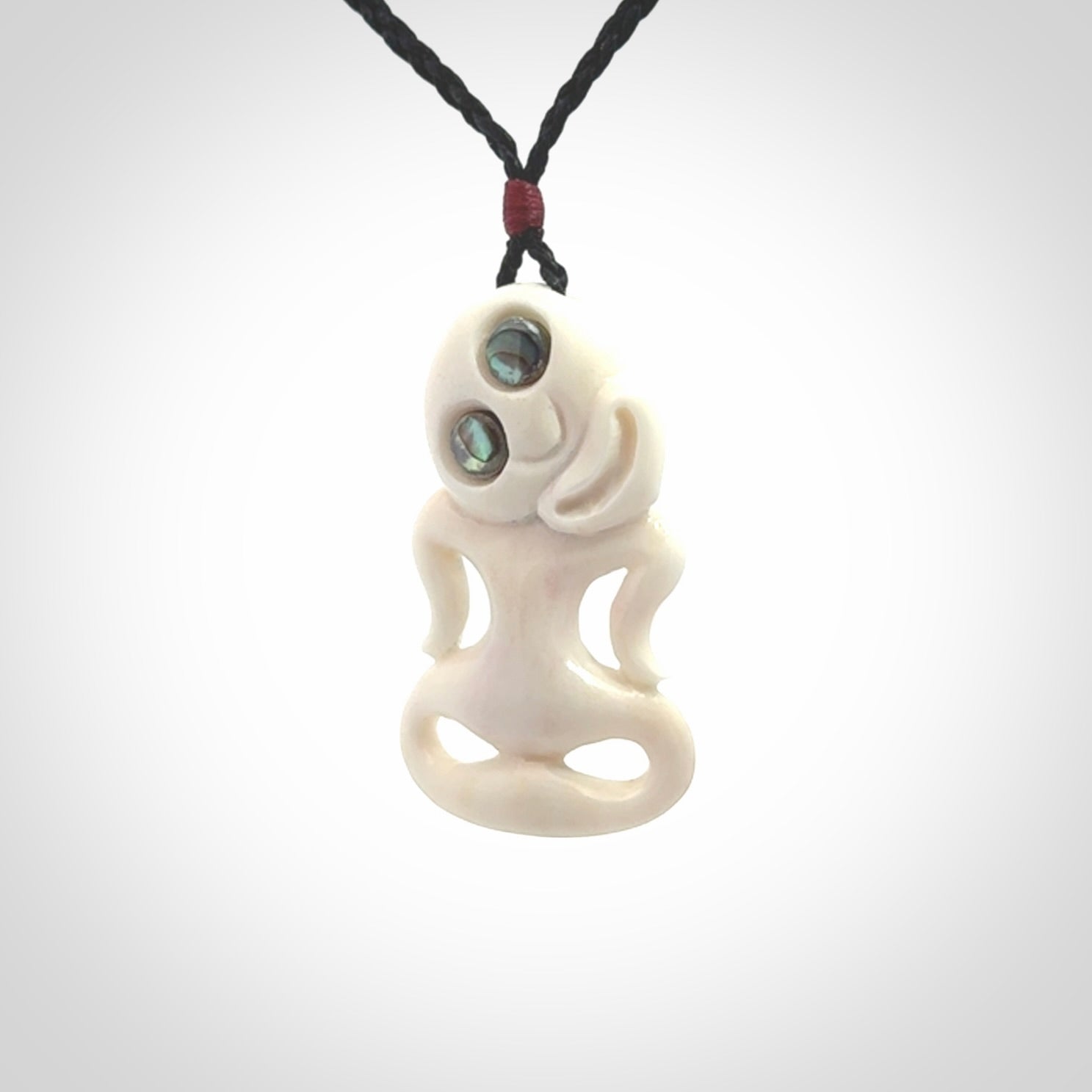 This little bone tiki has been carved to look and feel great. It has pāua shell eyes and is provided with an adjustable cord. A gorgeous and small traditional piece that is great for children.