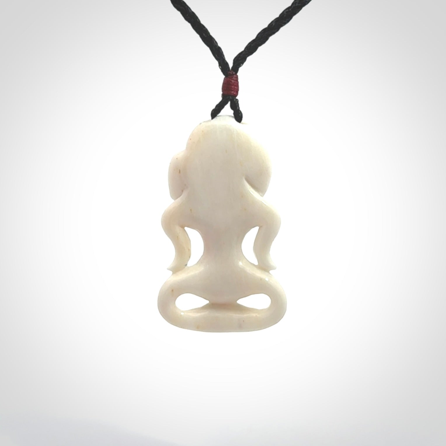 This little bone tiki has been carved to look and feel great. It has pāua shell eyes and is provided with an adjustable cord. A gorgeous and small traditional piece that is great for children.