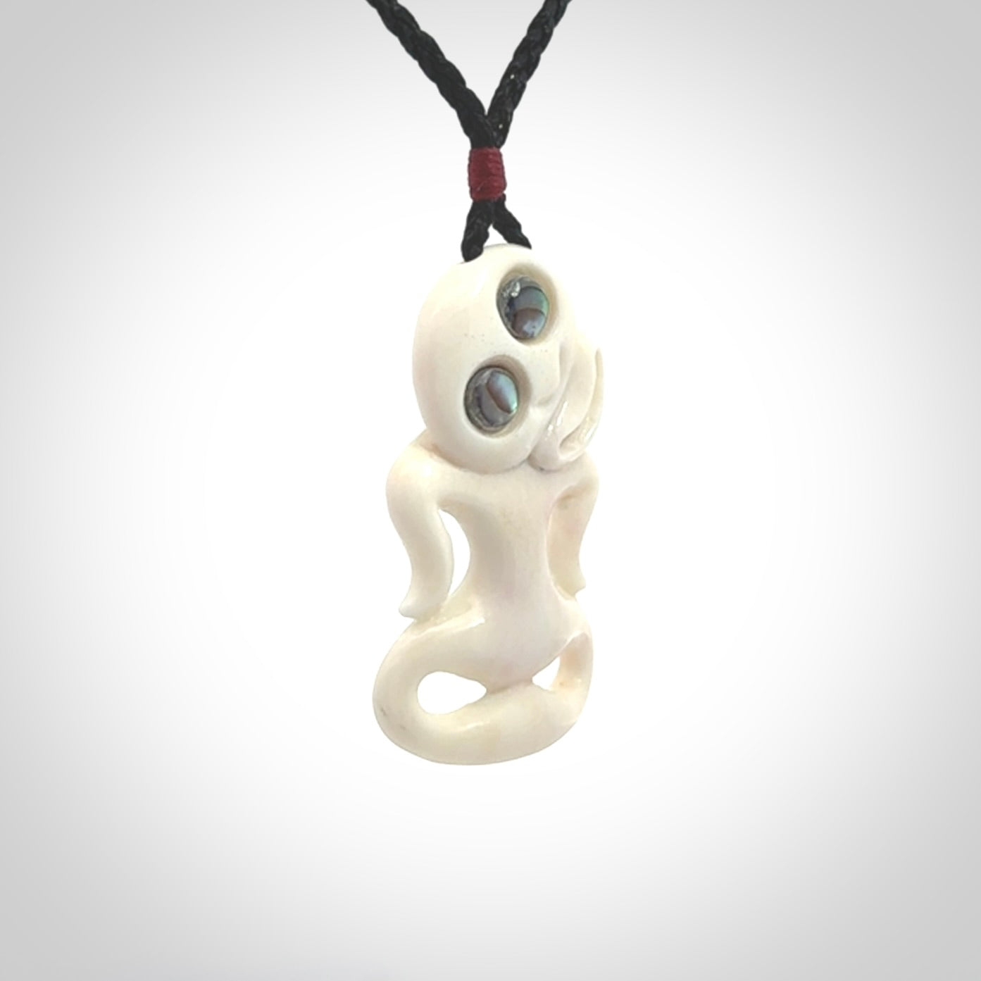 This little bone tiki has been carved to look and feel great. It has pāua shell eyes and is provided with an adjustable cord. A gorgeous and small traditional piece that is great for children.