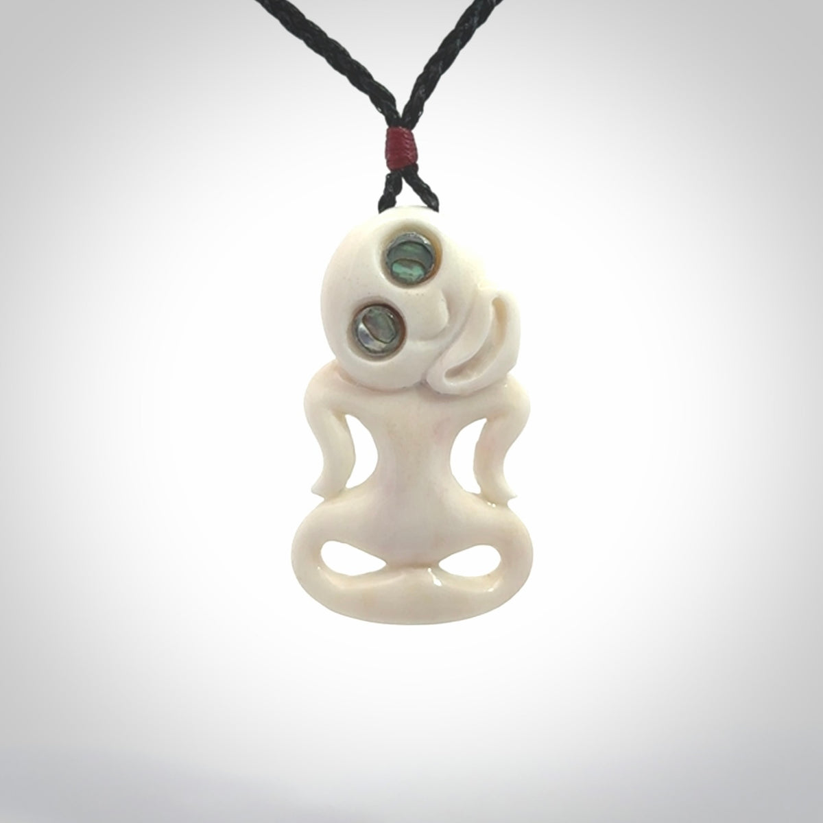 This little bone tiki has been carved to look and feel great. It has pāua shell eyes and is provided with an adjustable cord. A gorgeous and small traditional piece that is great for children.