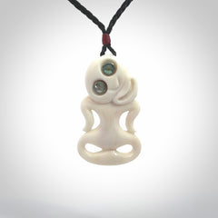 This little bone tiki has been carved to look and feel great. It has pāua shell eyes and is provided with an adjustable cord. A gorgeous and small traditional piece that is great for children.