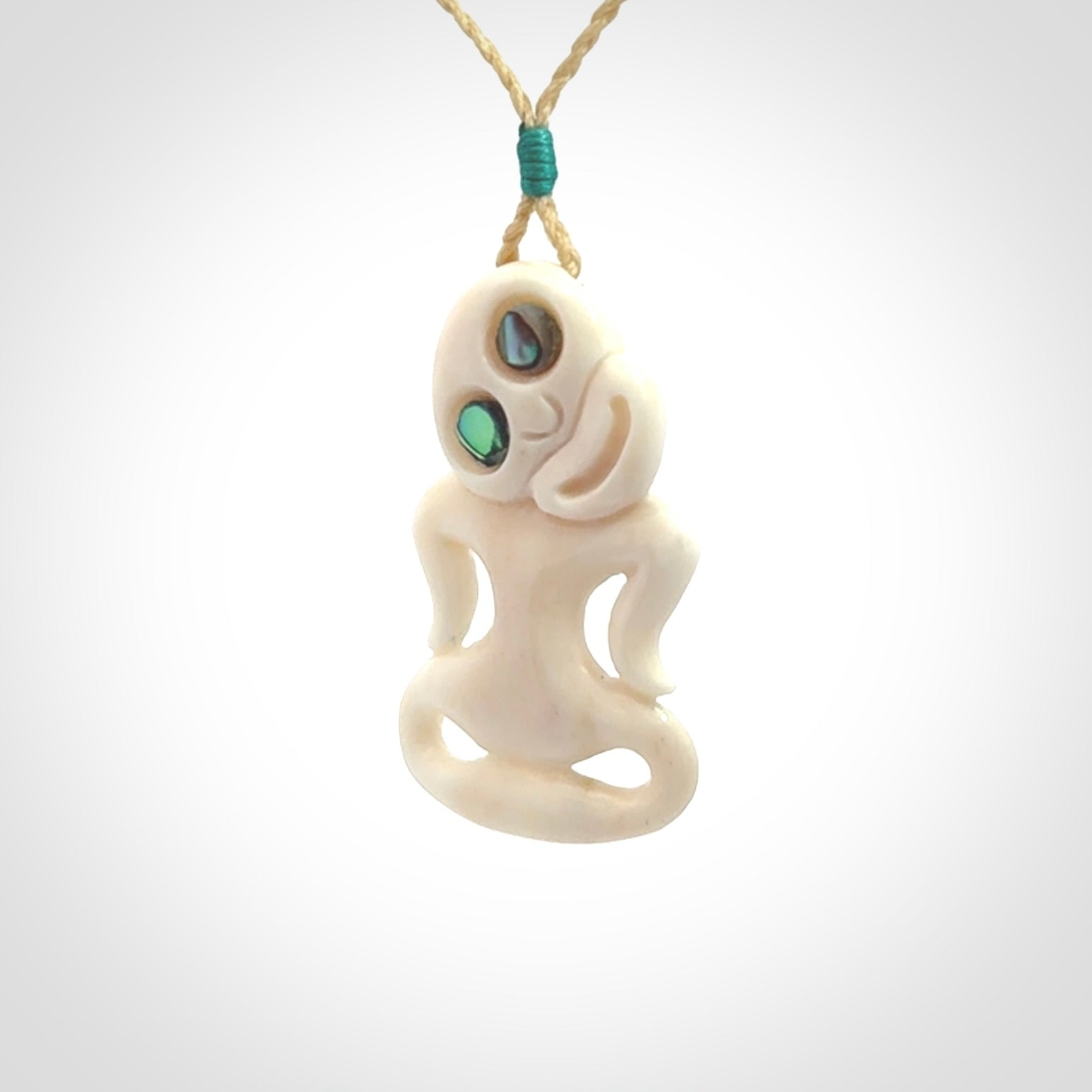 This little bone tiki has been carved to look and feel great. It has pāua shell eyes and is provided with an adjustable cord. A gorgeous and small traditional piece that is great for children.