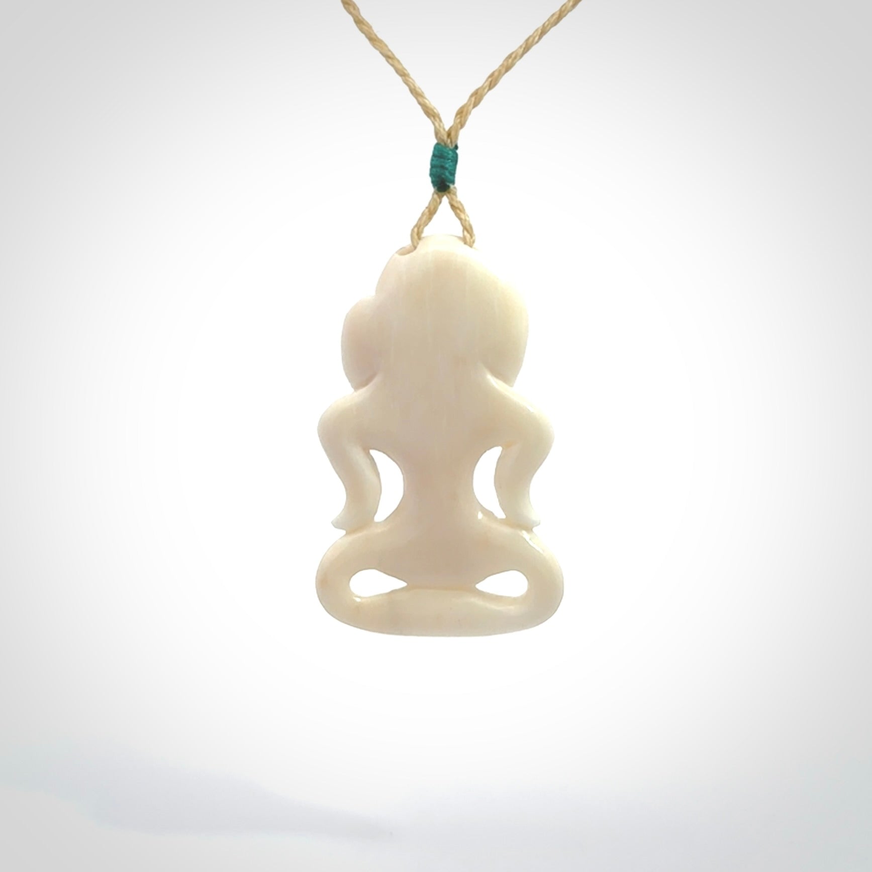 This little bone tiki has been carved to look and feel great. It has pāua shell eyes and is provided with an adjustable cord. A gorgeous and small traditional piece that is great for children.