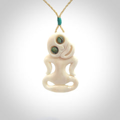 This little bone tiki has been carved to look and feel great. It has pāua shell eyes and is provided with an adjustable cord. A gorgeous and small traditional piece that is great for children.