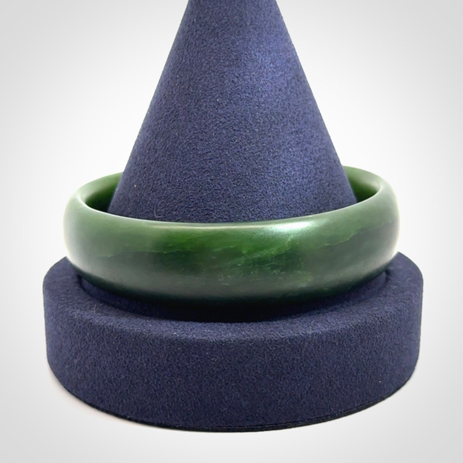 Hand carved New Zealand Jade bangle with matte finish, by Ric Moor. This is a spectacular one off, bracelet hand made in New Zealand from gorgeous Jade. Unique art to wear, delivered in a woven kete pouch. Real New Zealand Jade. Outstanding craftsmanship by New Zealand Master Carver Ric Moor.