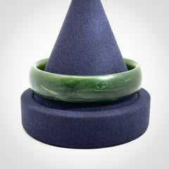 Hand carved New Zealand Jade bangle with matte finish, by Ric Moor. This is a spectacular one off, bracelet hand made in New Zealand from gorgeous Jade. Unique art to wear, delivered in a woven kete pouch. Real New Zealand Jade. Outstanding craftsmanship by New Zealand Master Carver Ric Moor.