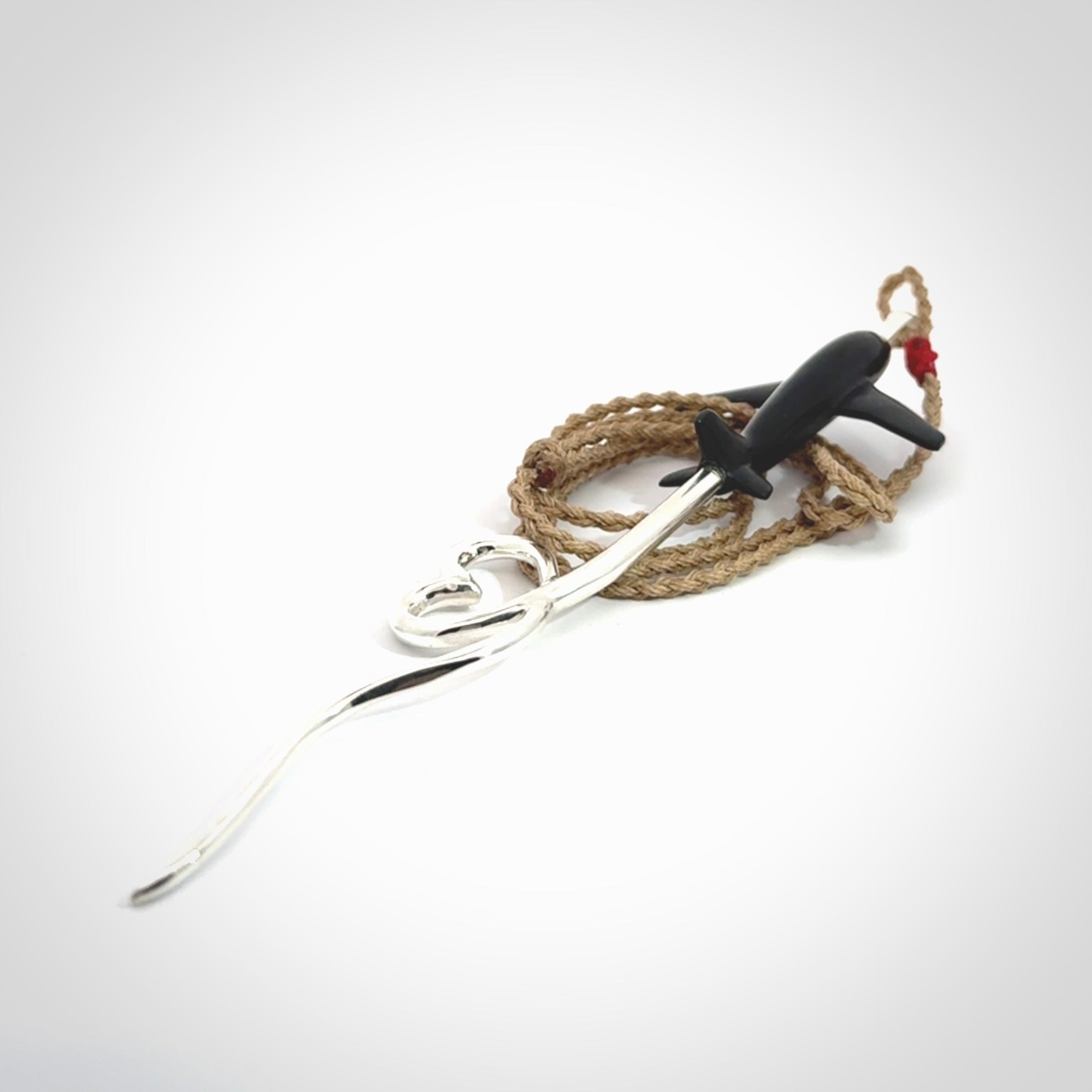 Hand carved plane and heart pendant from Australian Black Jade with Sterling Silver. This is a very cool piece of jewellery, hand made by NZ Pacific. We provide this with an adjustable cord. Free Postage Worldwide.