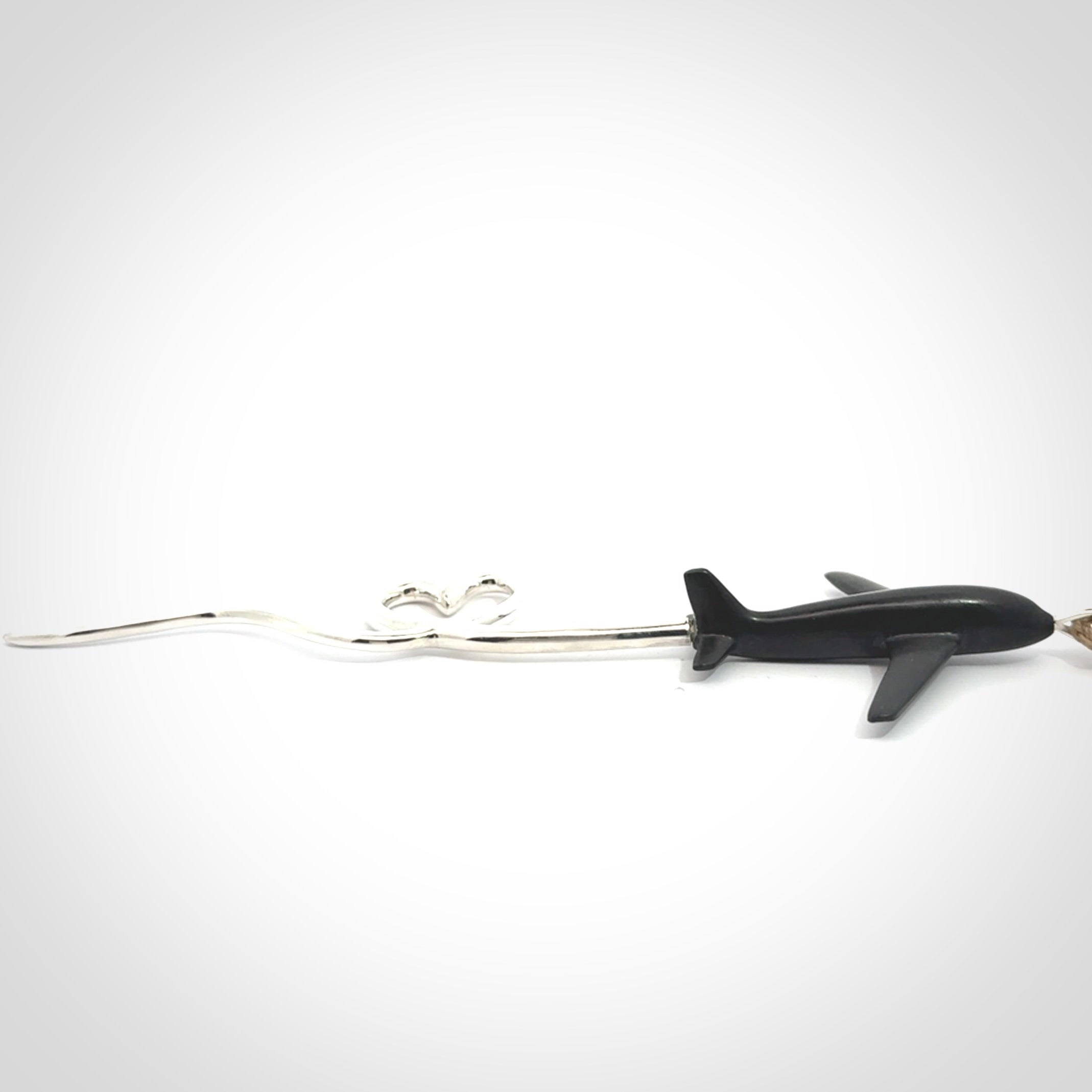 Hand carved plane and heart pendant from Australian Black Jade with Sterling Silver. This is a very cool piece of jewellery, hand made by NZ Pacific. We provide this with an adjustable cord. Free Postage Worldwide.