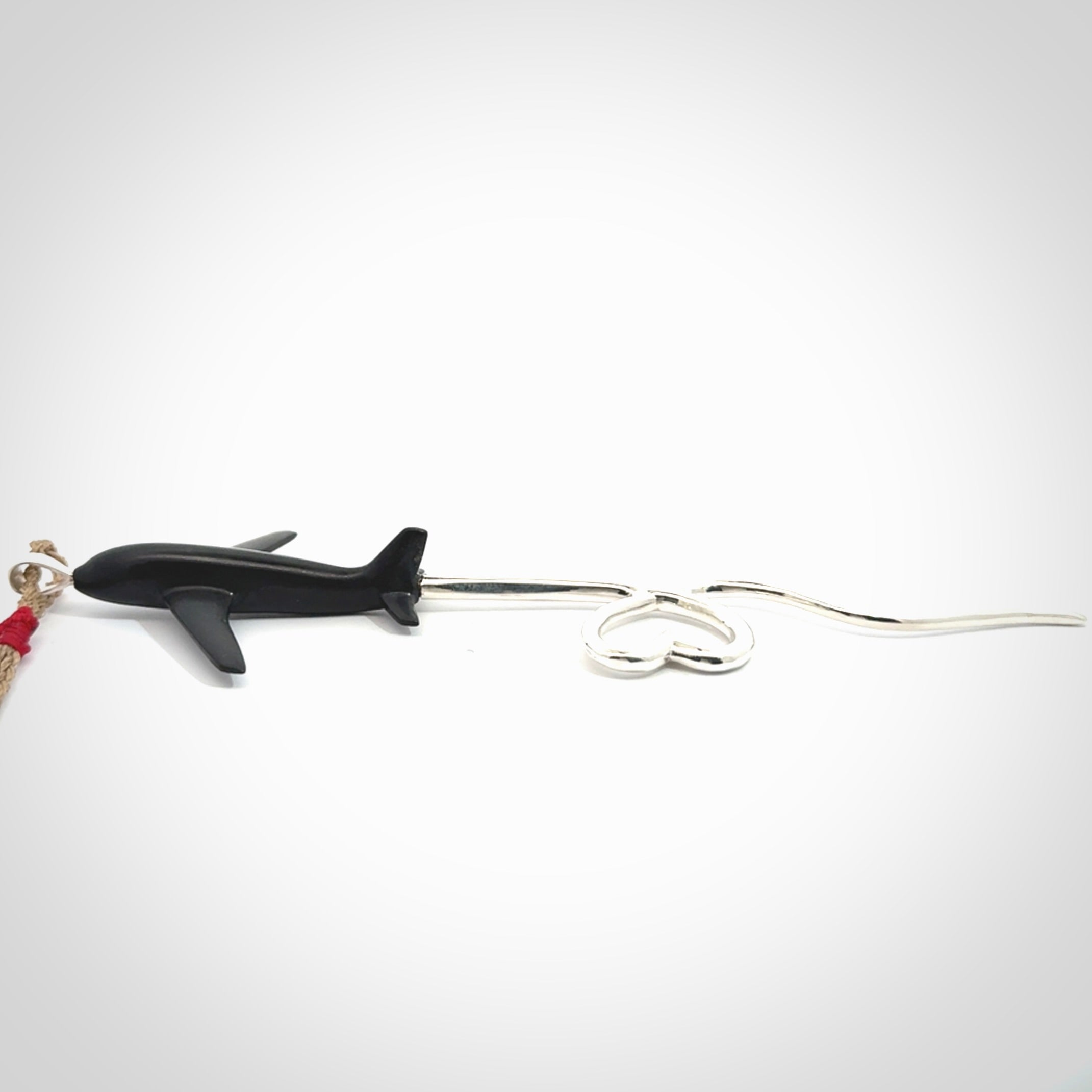 Hand carved plane and heart pendant from Australian Black Jade with Sterling Silver. This is a very cool piece of jewellery, hand made by NZ Pacific. We provide this with an adjustable cord. Free Postage Worldwide.