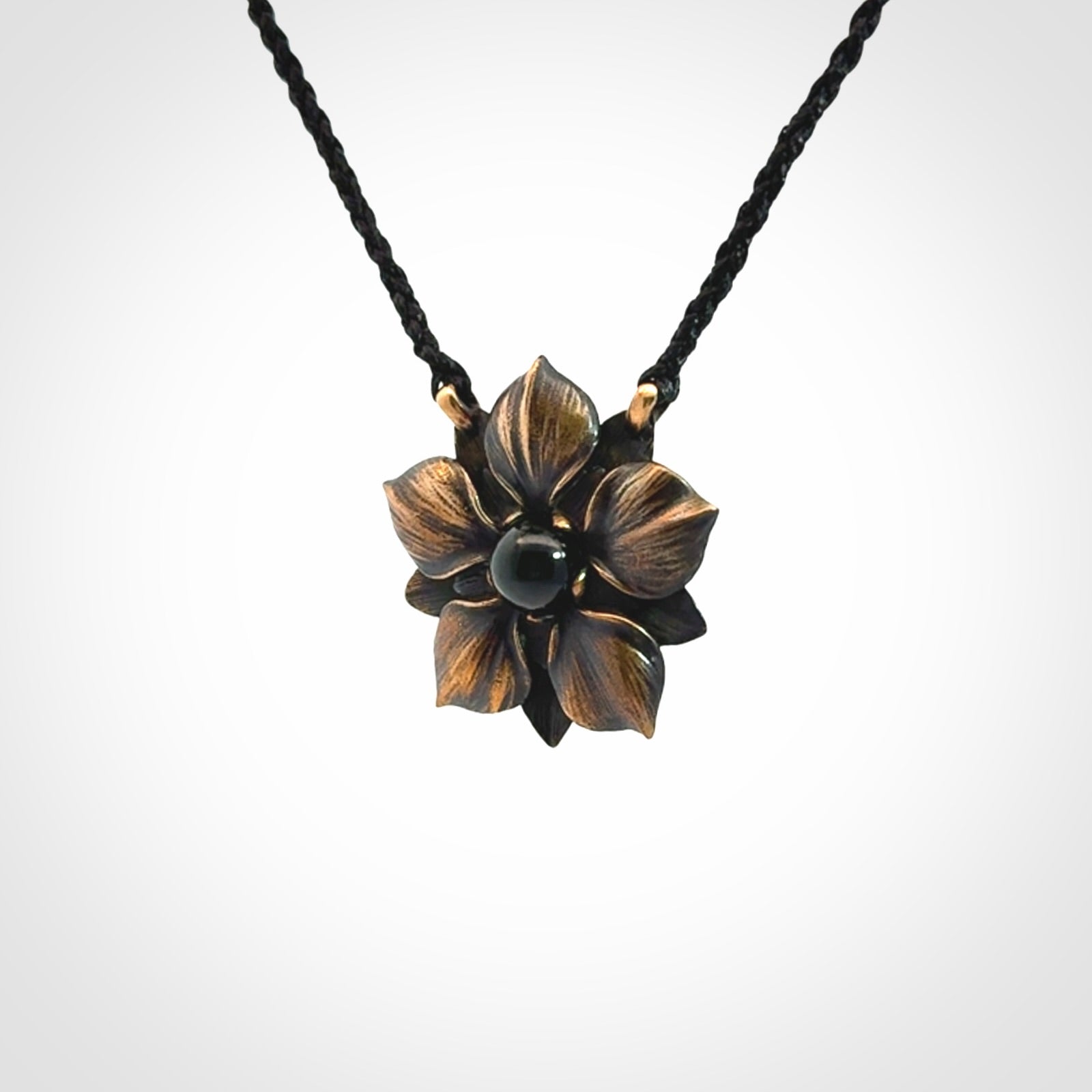 A Wonderful Bronze Manuka Pendant with New Zealand Jade insert