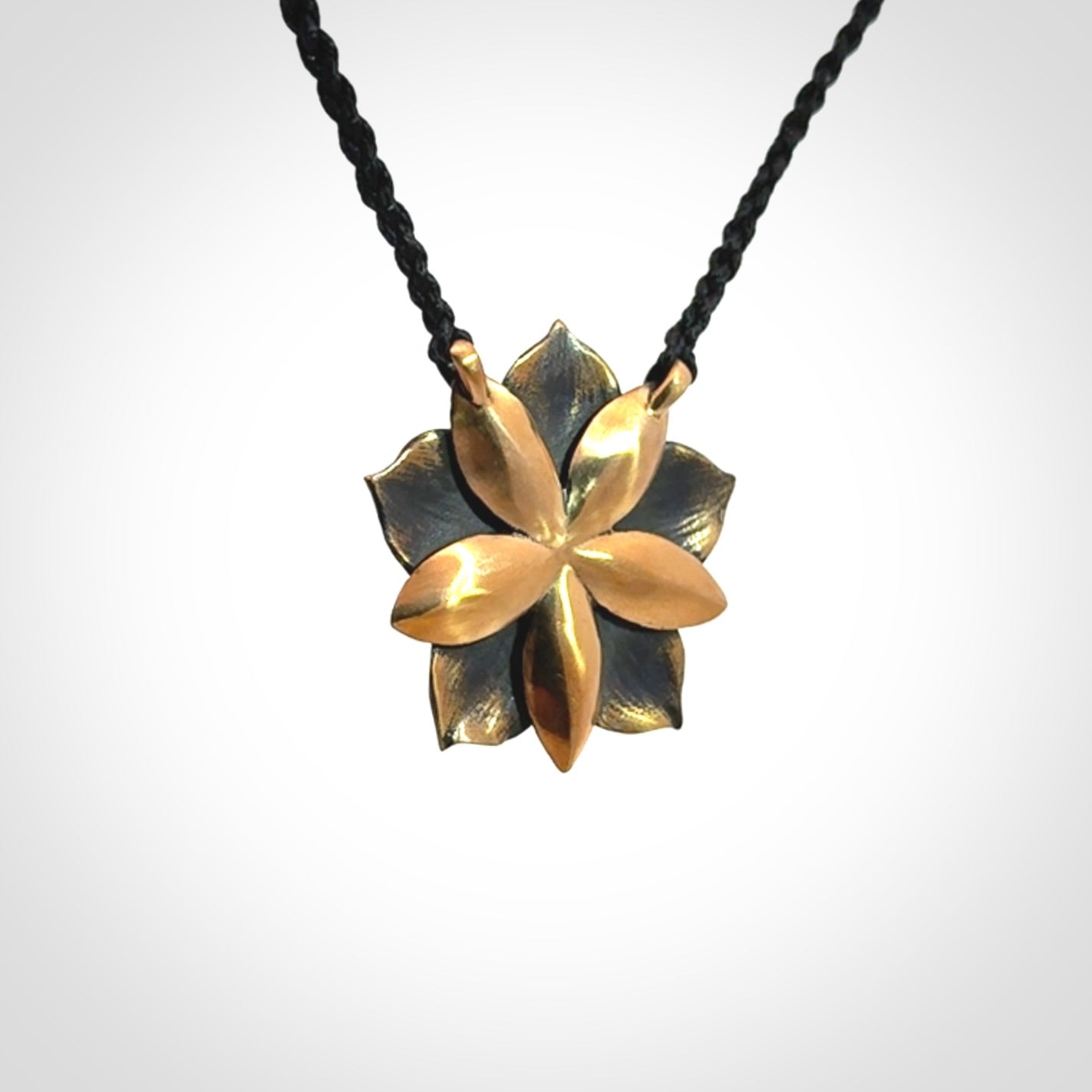 A Wonderful Bronze Manuka Pendant with New Zealand Jade insert