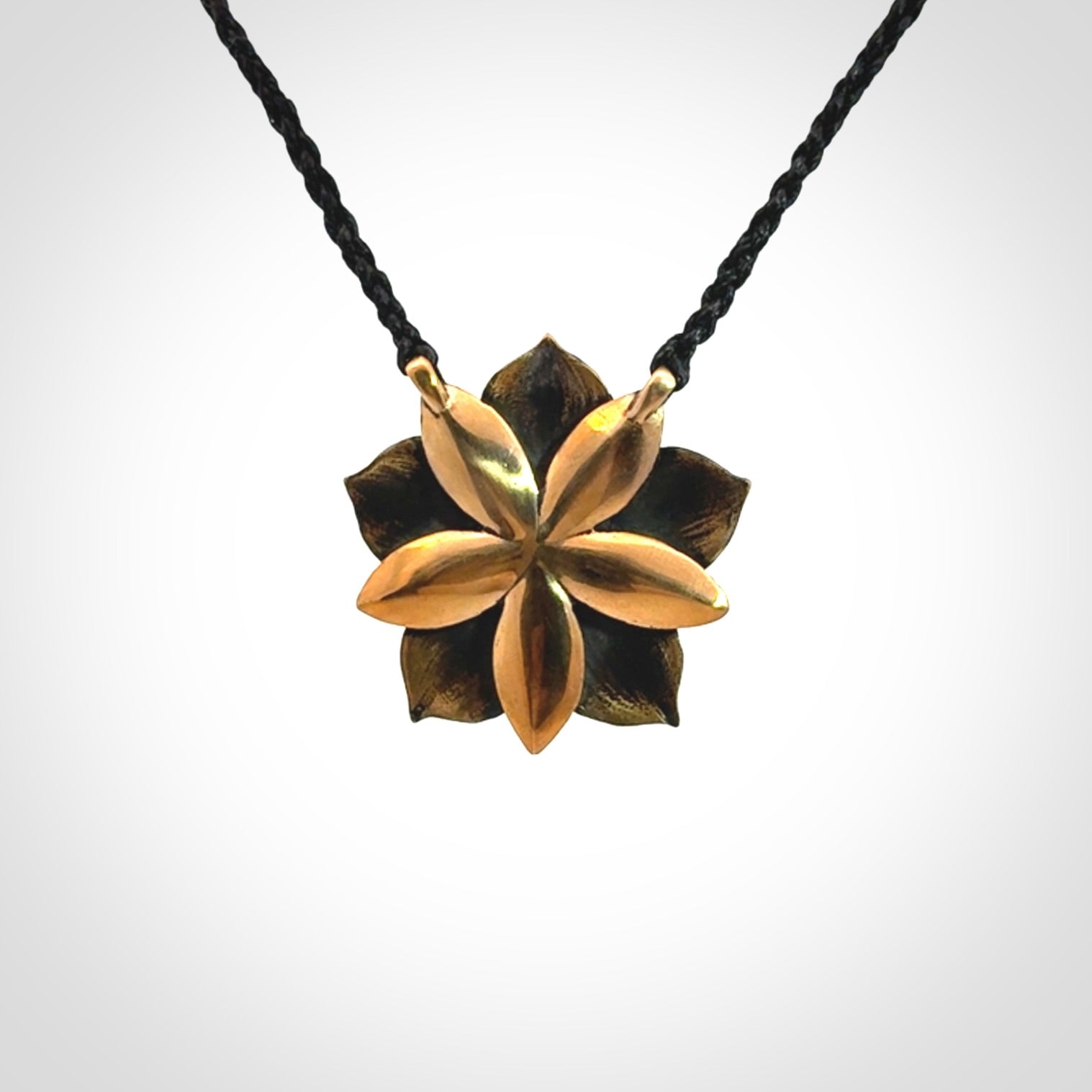 A Wonderful Bronze Manuka Pendant with New Zealand Jade insert