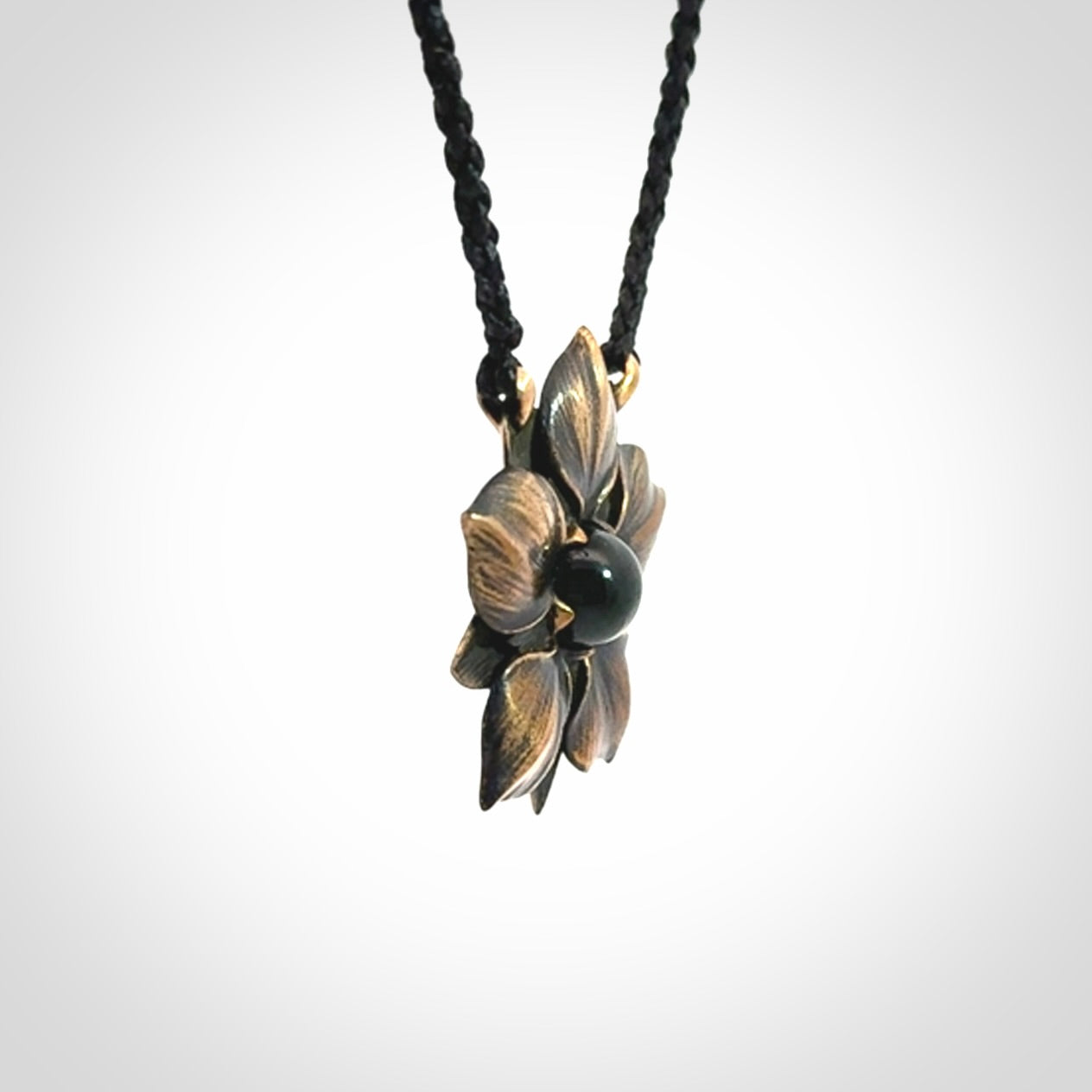 A Wonderful Bronze Manuka Pendant with New Zealand Jade insert