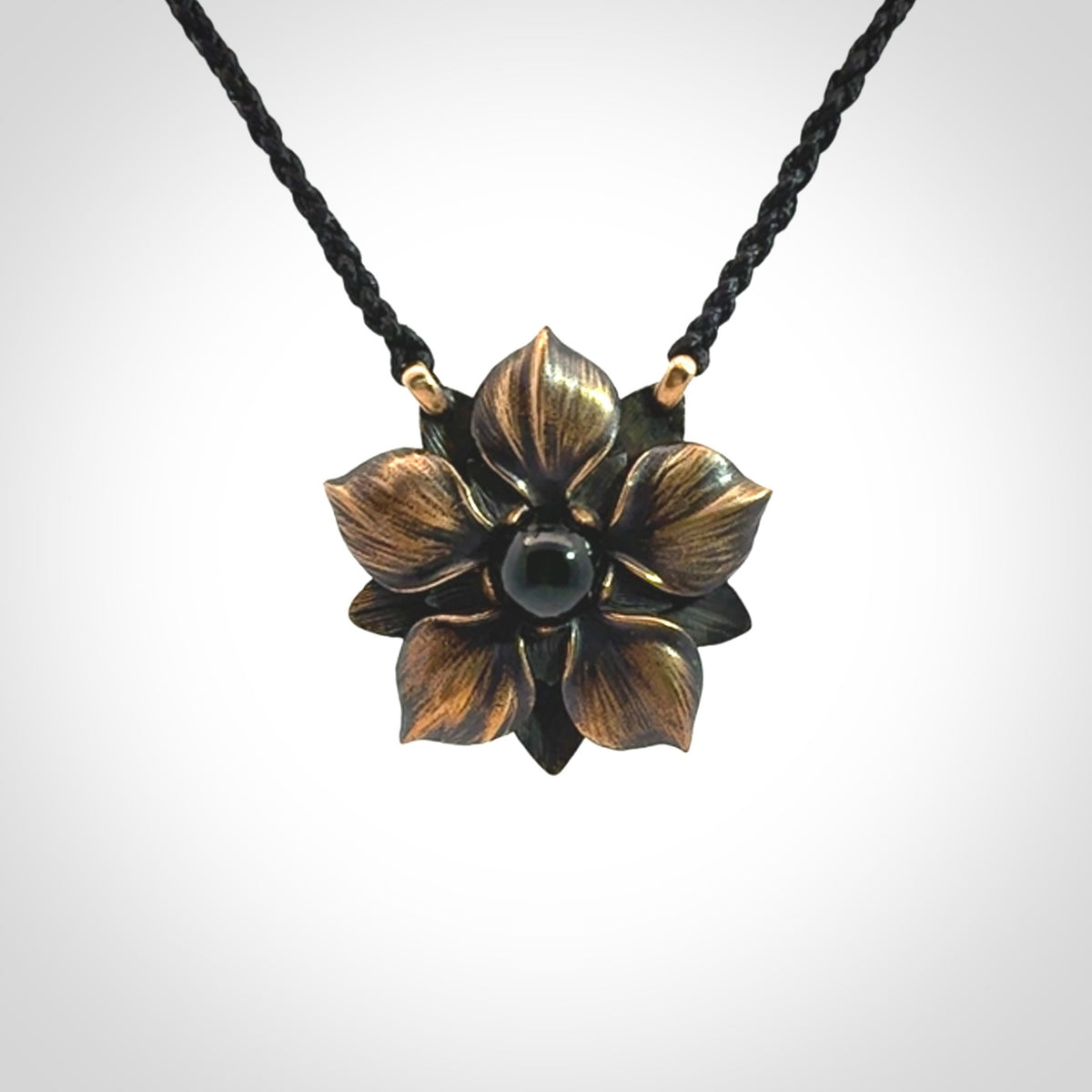 A Wonderful Bronze Manuka Pendant with New Zealand Jade insert