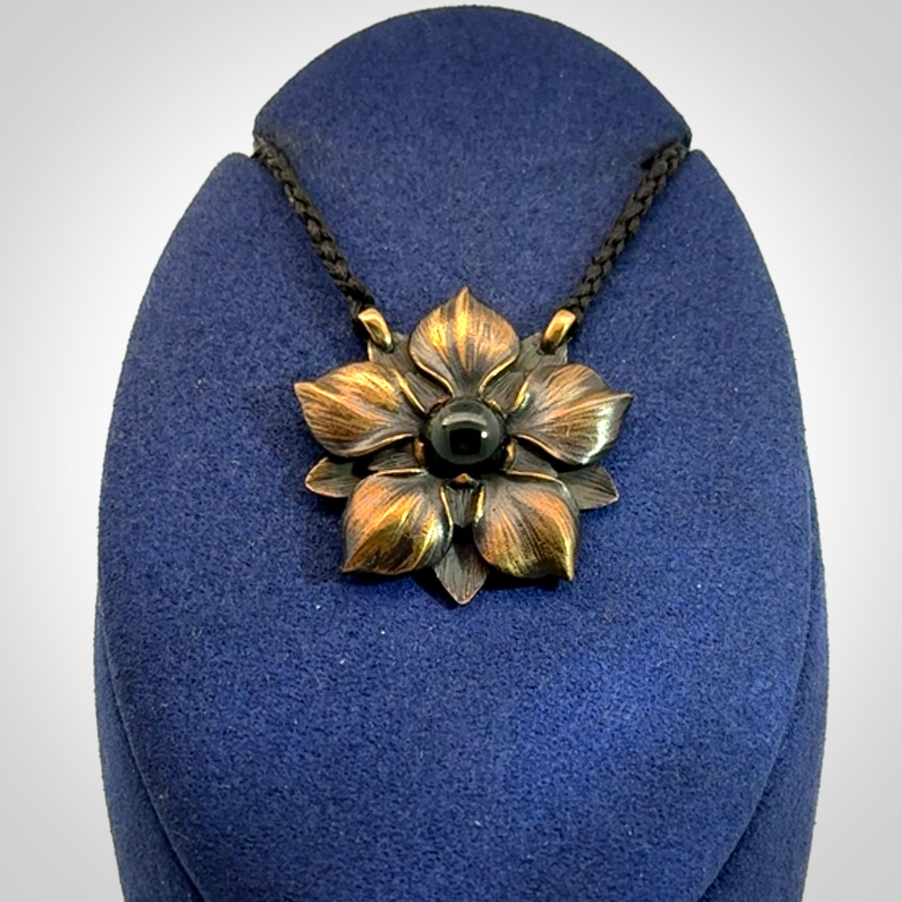 A Wonderful Bronze Manuka Pendant with New Zealand Jade insert