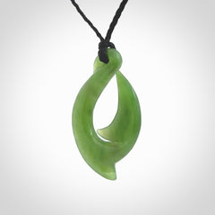 Hand made New Zealand Kahurangi Jade, hook, hei-matau pendant. Hand carved fish hook made from New Zealand jade. Carved by Ross Crump. Provided with adjustable black cord.