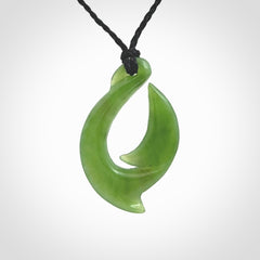 Hand made New Zealand Kahurangi Jade, hook, hei-matau pendant. Hand carved fish hook made from New Zealand jade. Carved by Ross Crump. Provided with adjustable black cord.