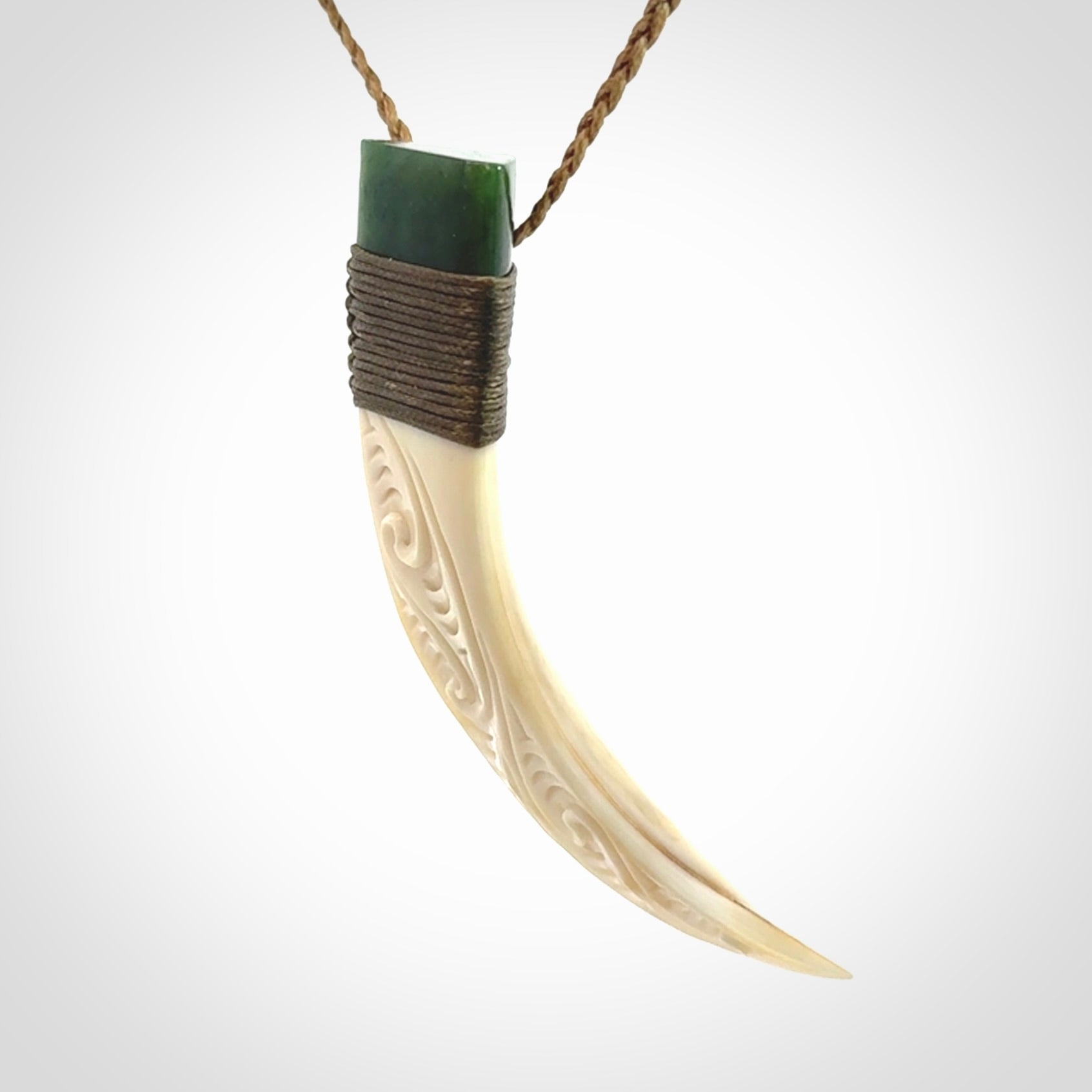 Hand carved boars tusk and jade pendant