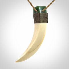 Hand carved boars tusk and jade pendant
