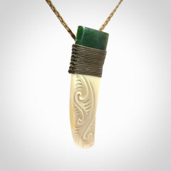 Hand carved boars tusk and jade pendant