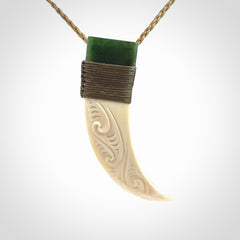 Hand carved boars tusk and jade pendant