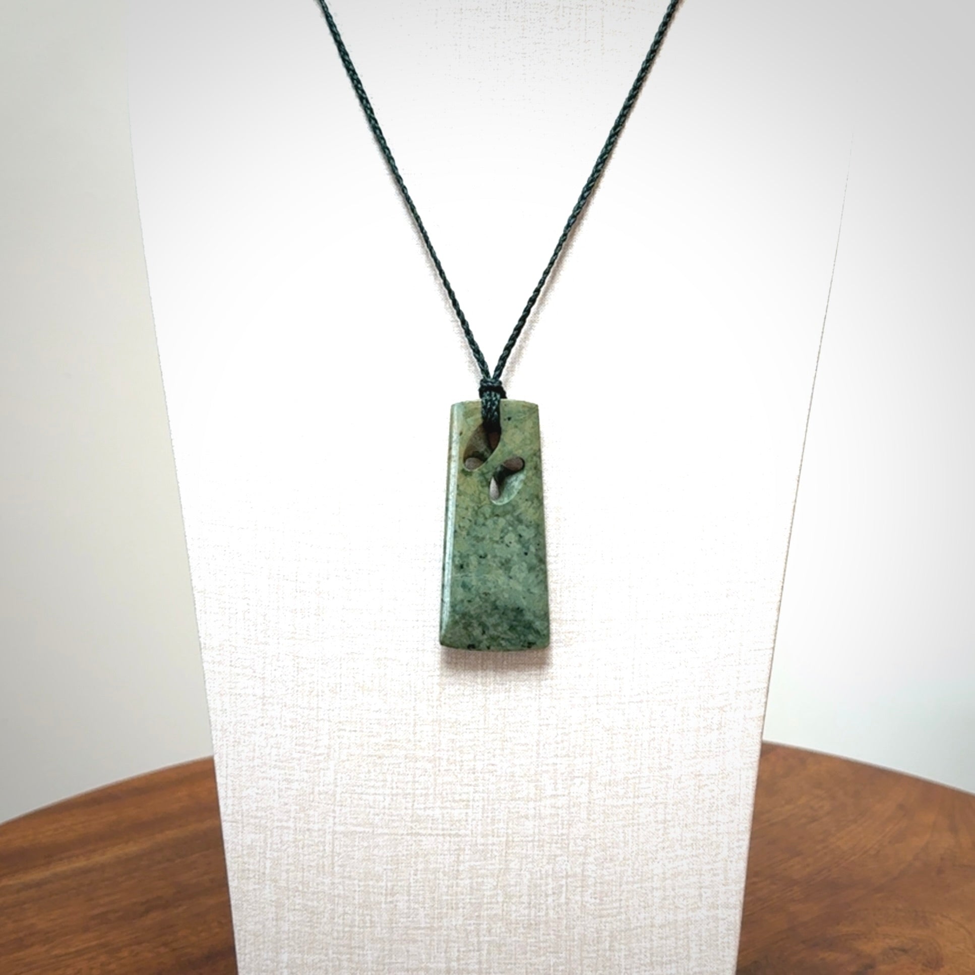 Hand carved New Zealand jade, complex twist pendant. Hand made complex twist pendant hand carved in New Zealand.