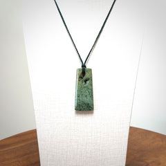 Hand carved New Zealand jade, complex twist pendant. Hand made complex twist pendant hand carved in New Zealand.