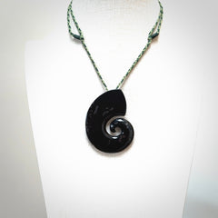 A hand carved koru pendant from New Zealand Tangiwai Pounamu. The cord is a Fern/Manuka Green colour and is an adjustable length. A large hand made Koru necklace by New Zealand artist Kerry Thompson.
