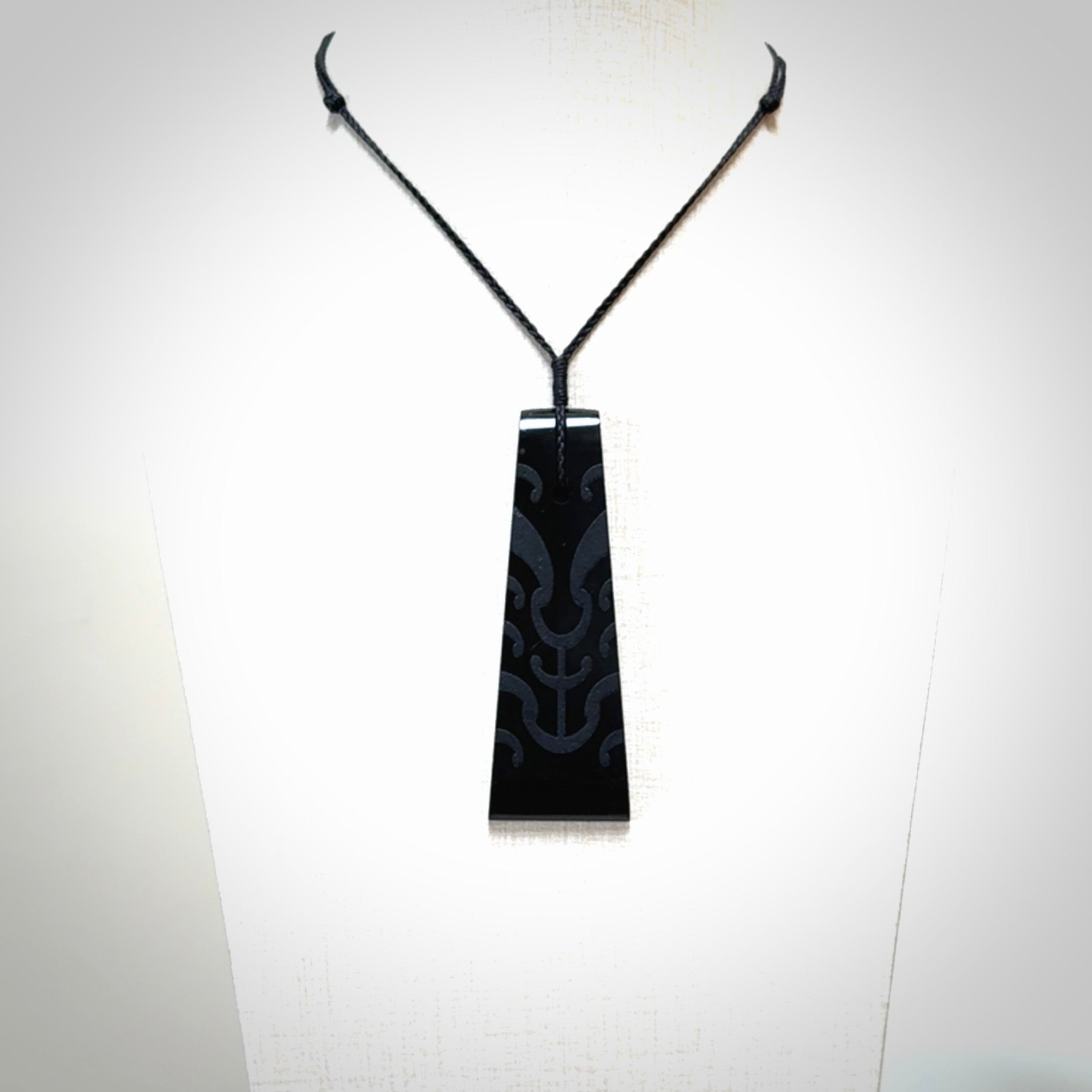Hand made large New Zealand Tangiwai toki with koru pendant. Hand carved in New Zealand by Kerry Thompson. Unique large Jade Toki with adjustable cord.