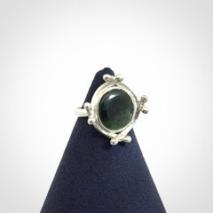 This is a handcrafted New Zealand Pounamu, Jade and sterling silver ring. 