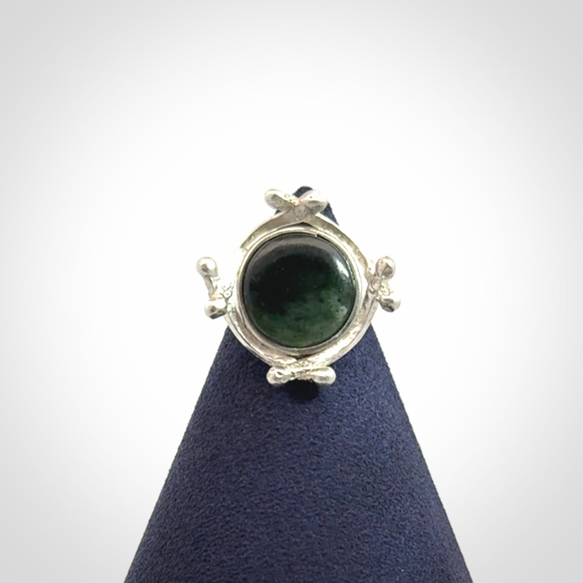 This is a handcrafted New Zealand Pounamu, Jade and sterling silver ring. 