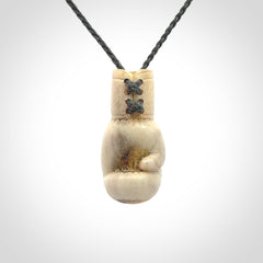 Hand carved boxing glove made from deer antler. The cord is adjustable so that you can wear this where it suits you best.