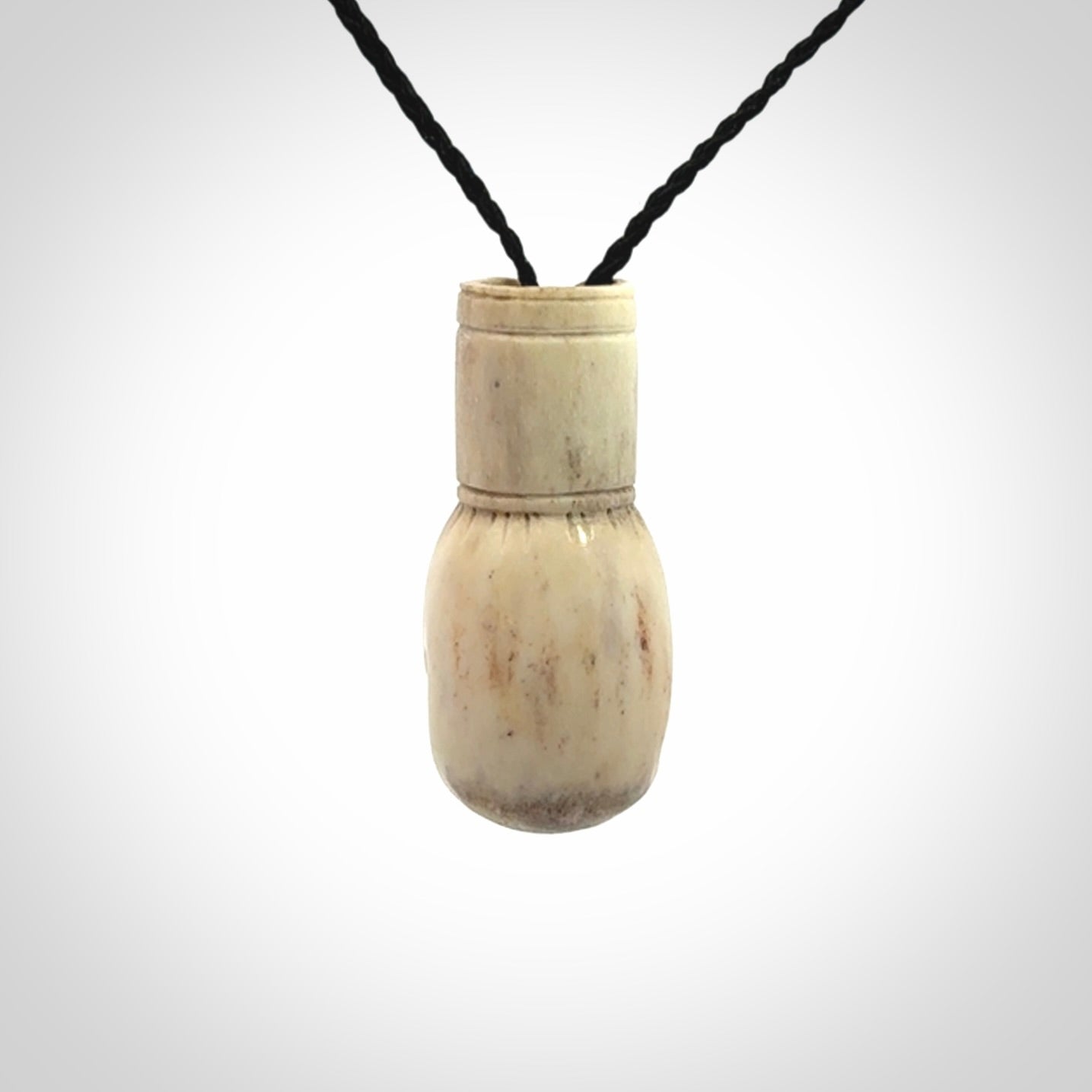 Hand carved boxing glove made from deer antler. The cord is adjustable so that you can wear this where it suits you best.