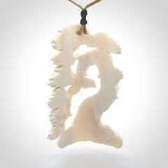 This is a beautiful hand carved tree pendant. It is a wonderfully detailed pendant that we have carved in natural, untreated bone. We provide this with a tan coloured adjustable cord and shipping is included worldwide.