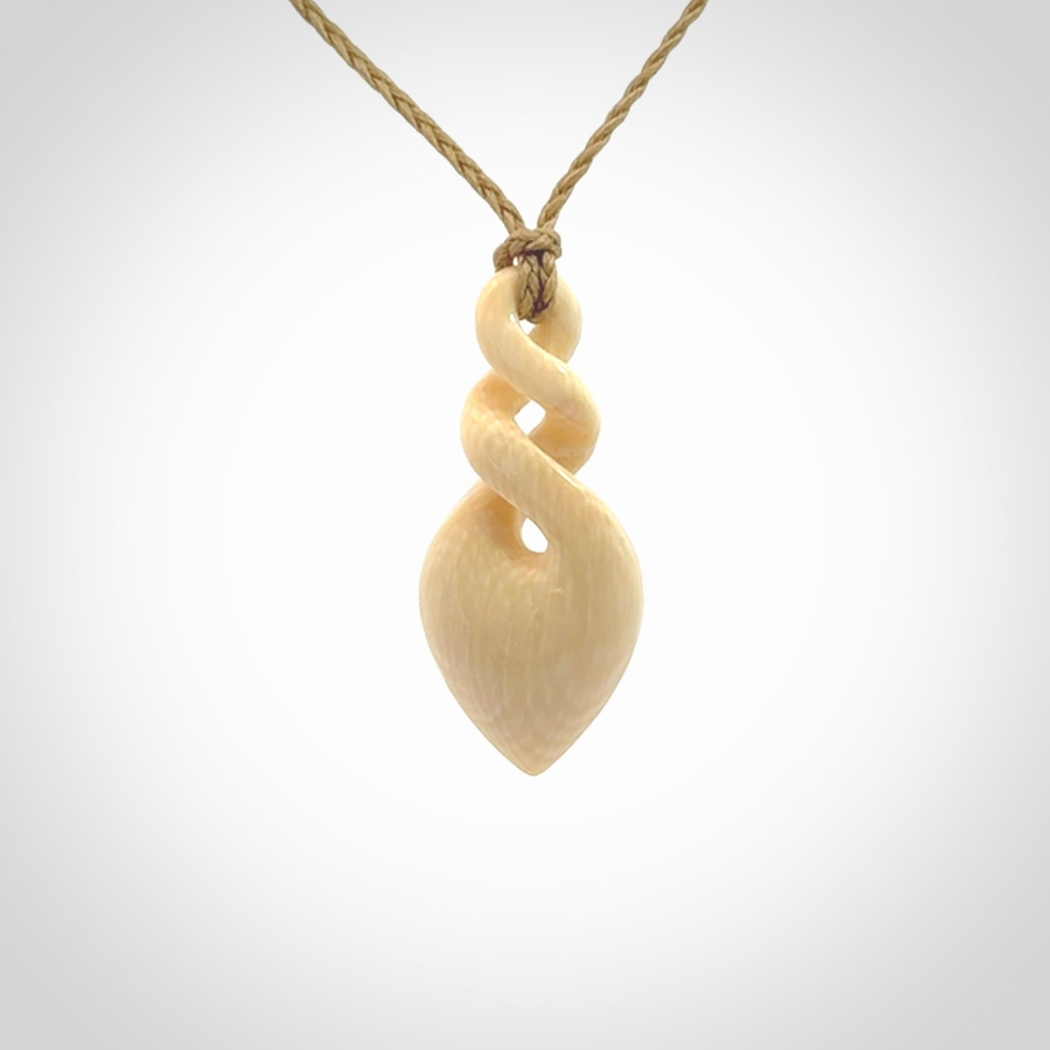 Elegant and striking twist pendants carved from mammoth tusk that's over 30,000 years old - a beautiful and ancient material.