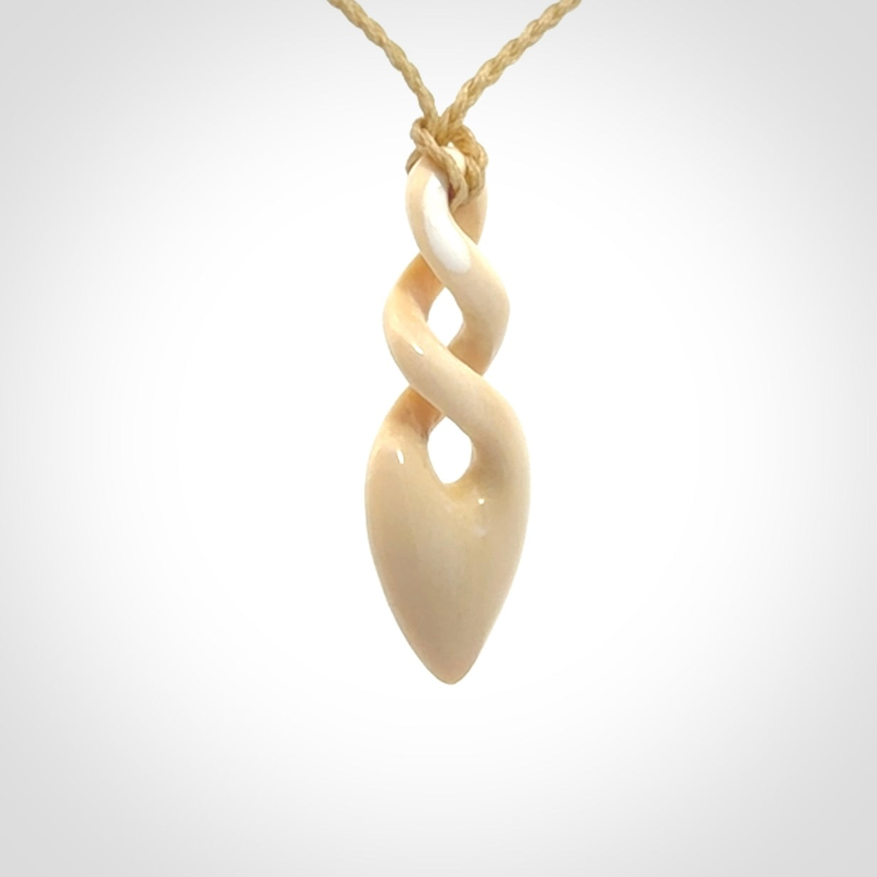 Hand carved woolly mammoth tusk twist pendant. Made by NZ Pacific.