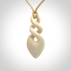 Hand carved woolly mammoth ivory twist pendant. Made by NZ Pacific.