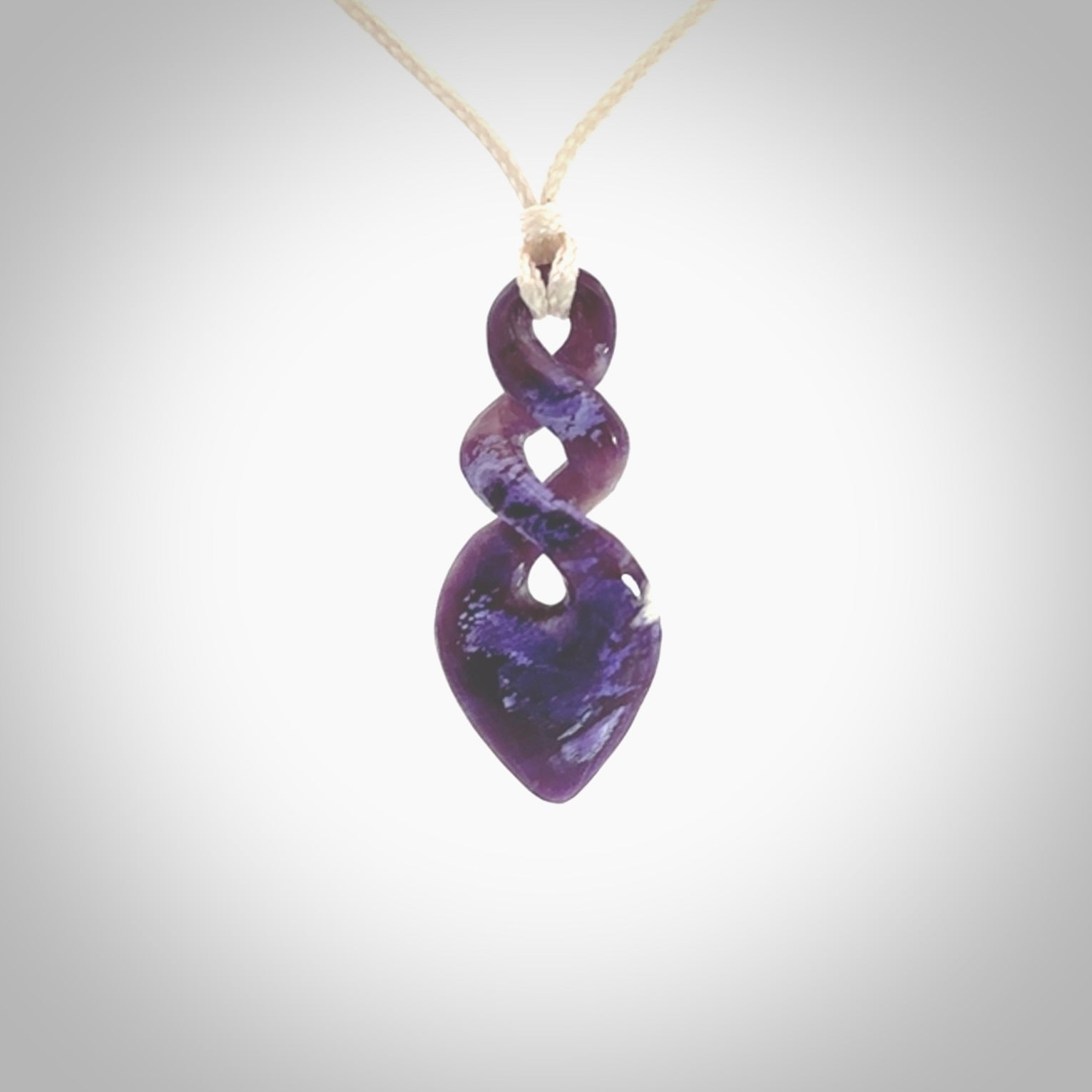 Hand carved woolly mammoth tusk double twist pendant. Made by NZ Pacific.