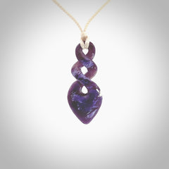 Hand carved woolly mammoth tusk double twist pendant. Made by NZ Pacific.