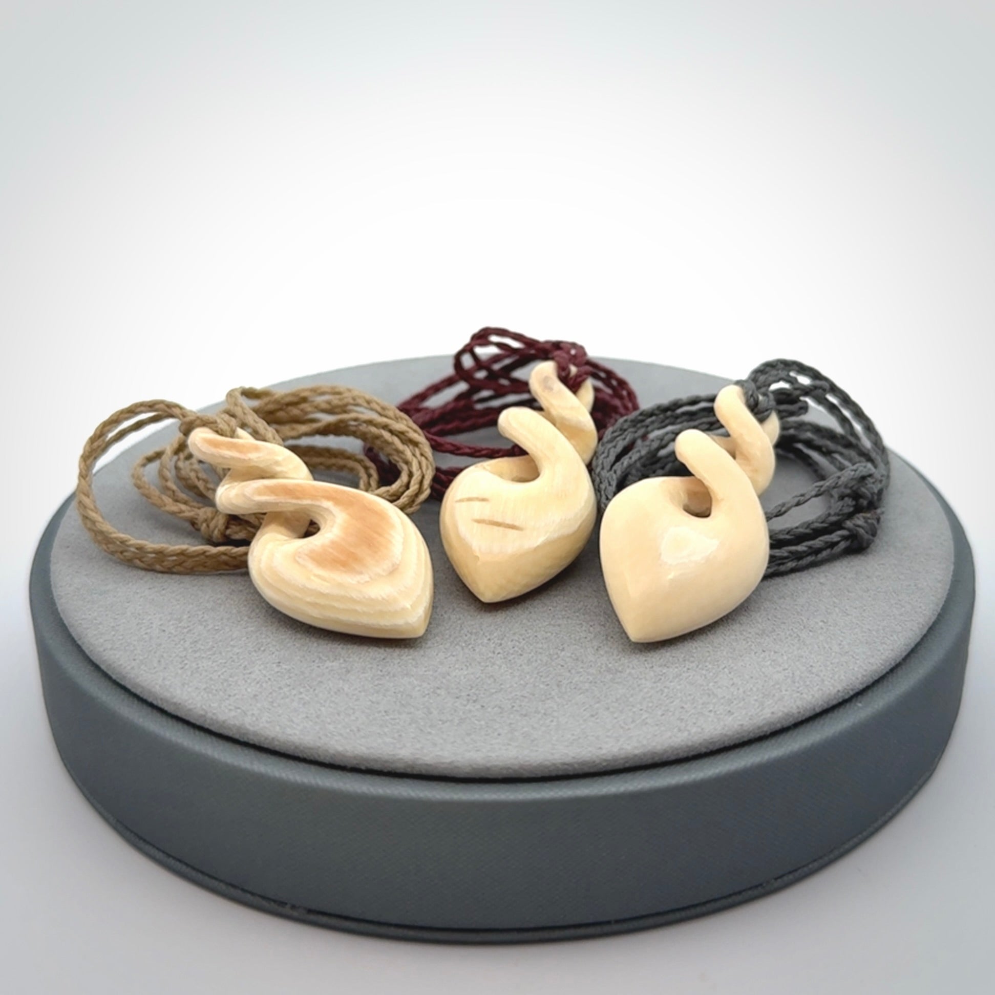 Elegant and striking twist pendants carved from mammoth tusk that's over 30,000 years old - a beautiful and ancient material.