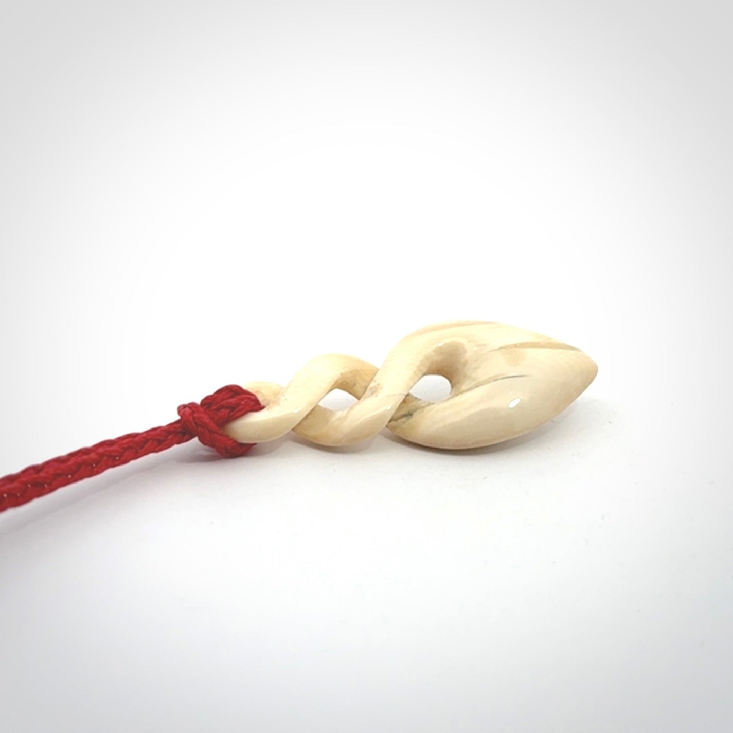 Hand carved woolly mammoth tusk twist pendant. Made by NZ Pacific.