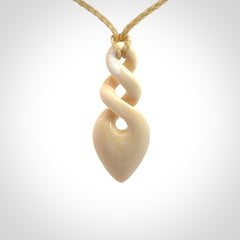 Hand carved woolly mammoth tusk twist pendant. Made by NZ Pacific.