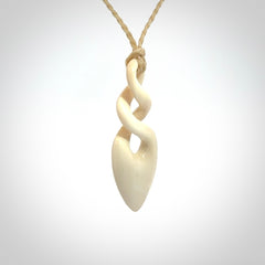 Hand carved woolly mammoth ivory twist pendant. Made by NZ Pacific.