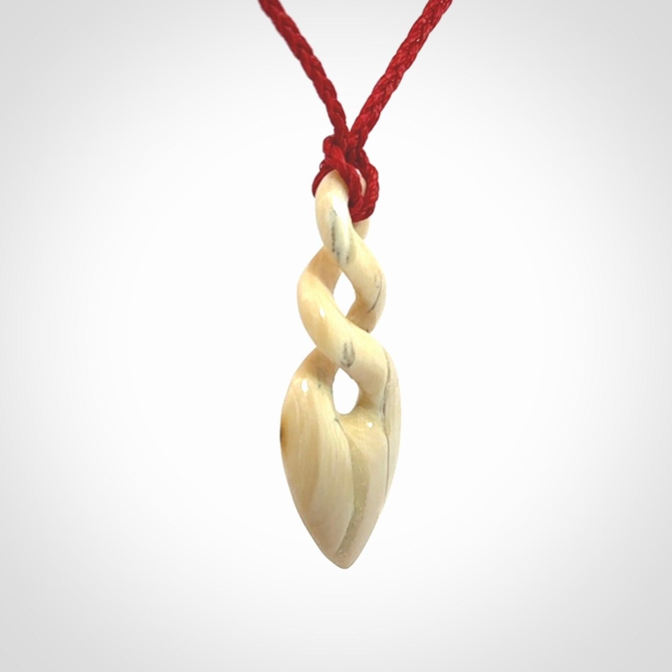 Hand carved woolly mammoth tusk twist pendant. Made by NZ Pacific.