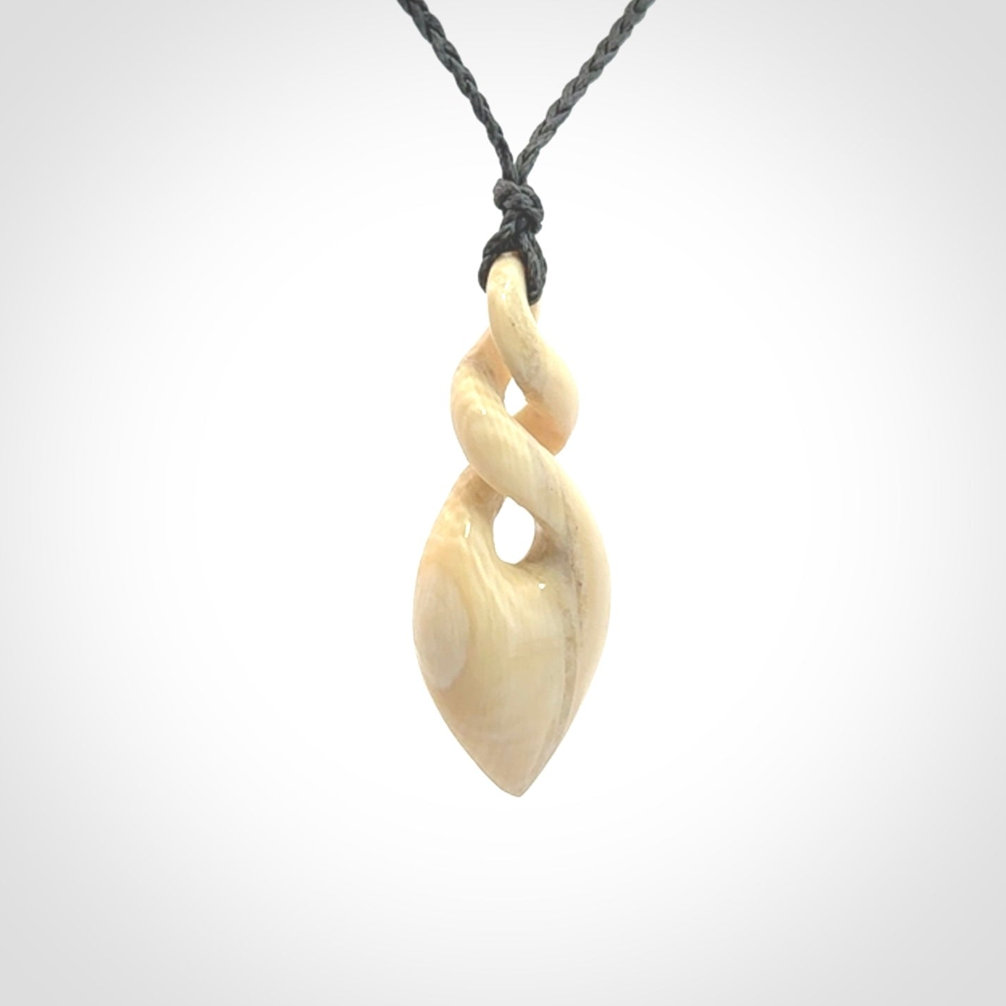 Elegant and striking twist pendants carved from mammoth tusk that's over 30,000 years old - a beautiful and ancient material.