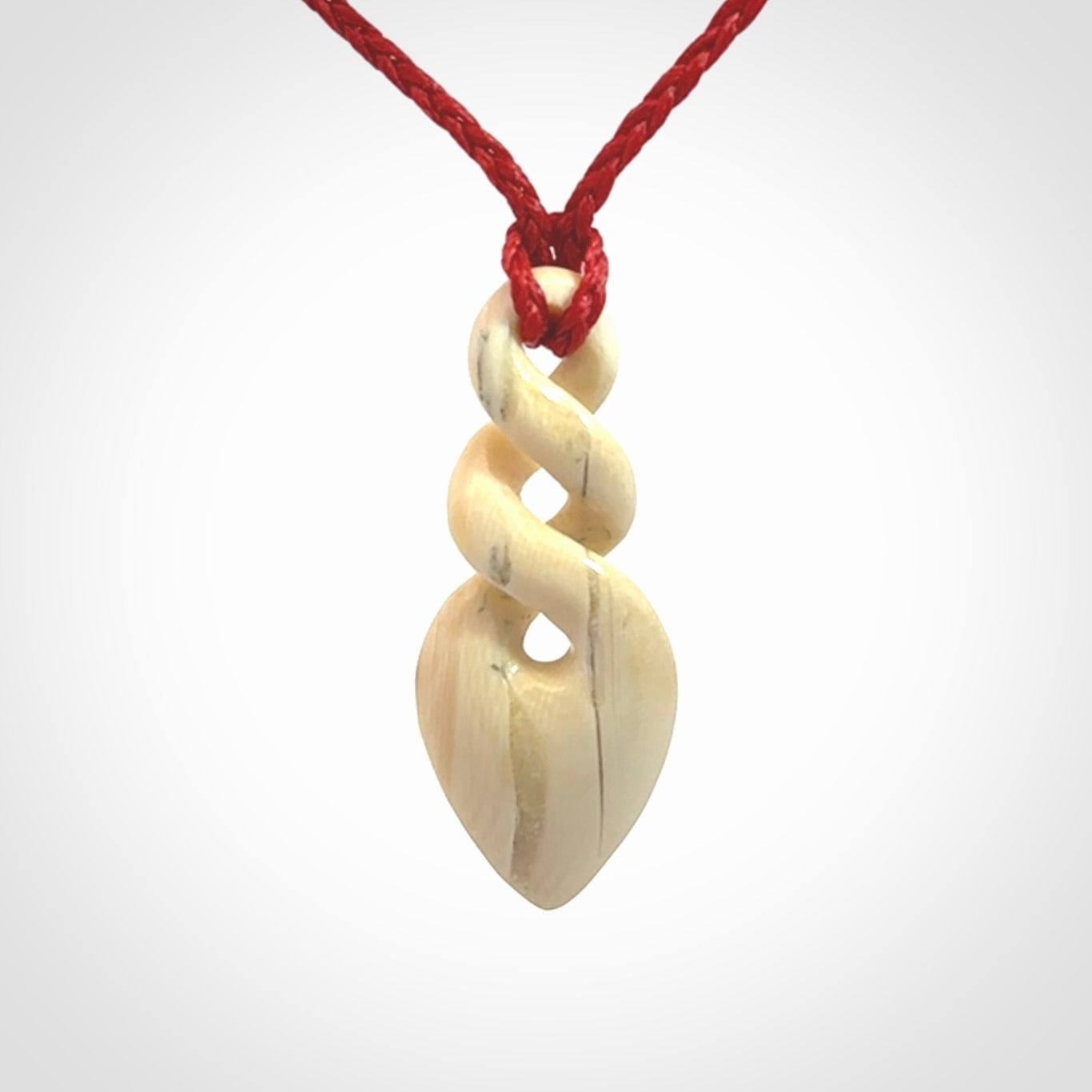 Hand carved woolly mammoth tusk twist pendant. Made by NZ Pacific.